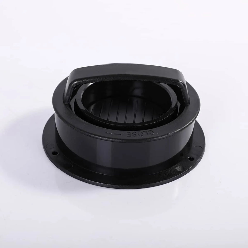 Black plastic component on a white background