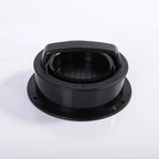 Black plastic component on a white background