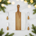 Wooden and marble cutting board with four cheese tools on a white background