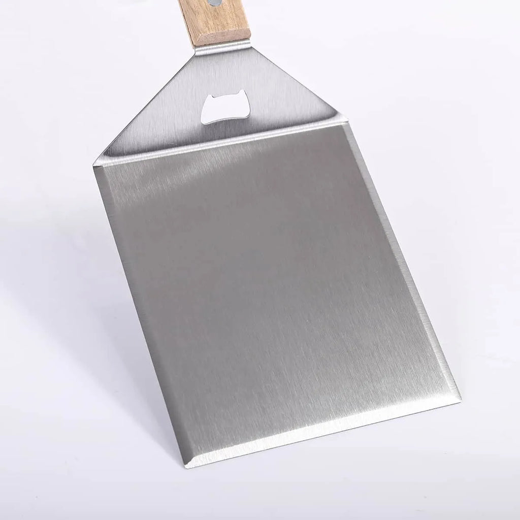 Metal spatula with wooden handle on a white background