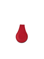 Red leather key case on a white background
