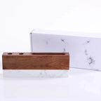 Wooden pencil holder on a marble surface