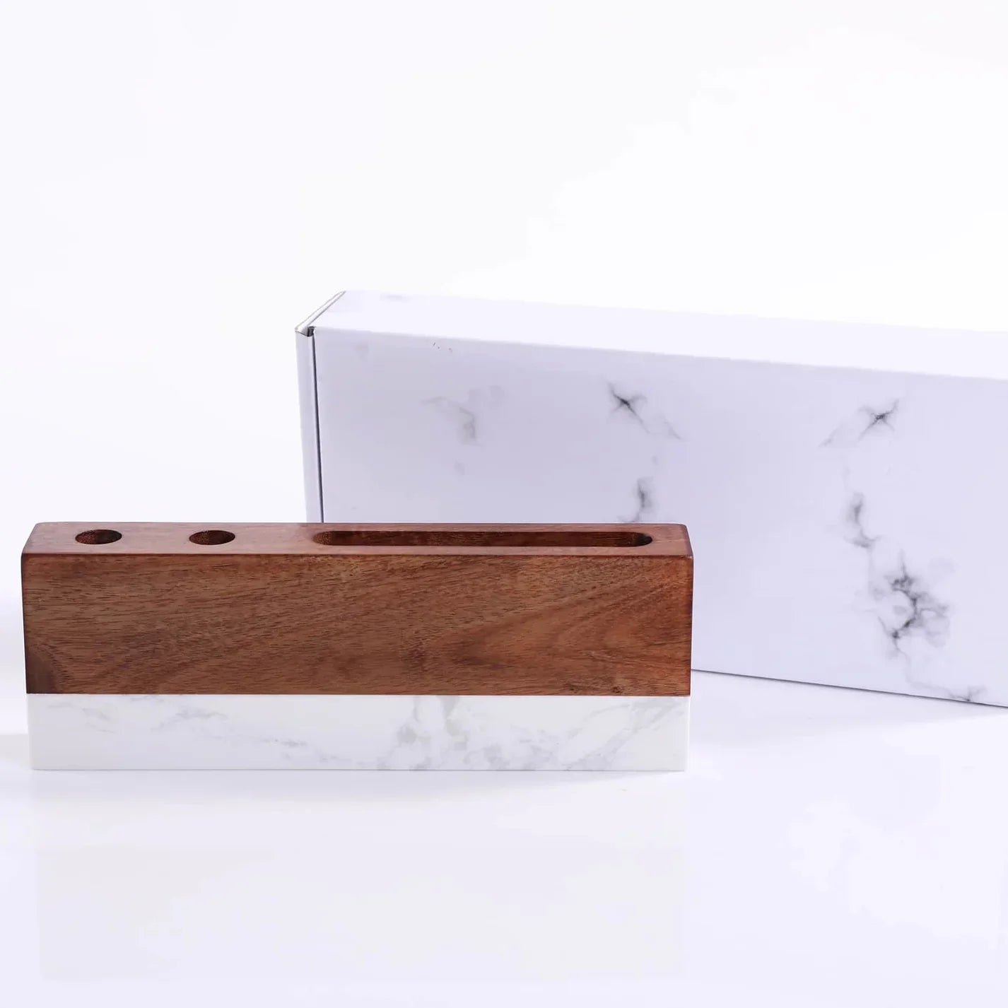 Wooden pencil holder on a marble surface