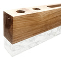 Wooden block with three holes on a white background