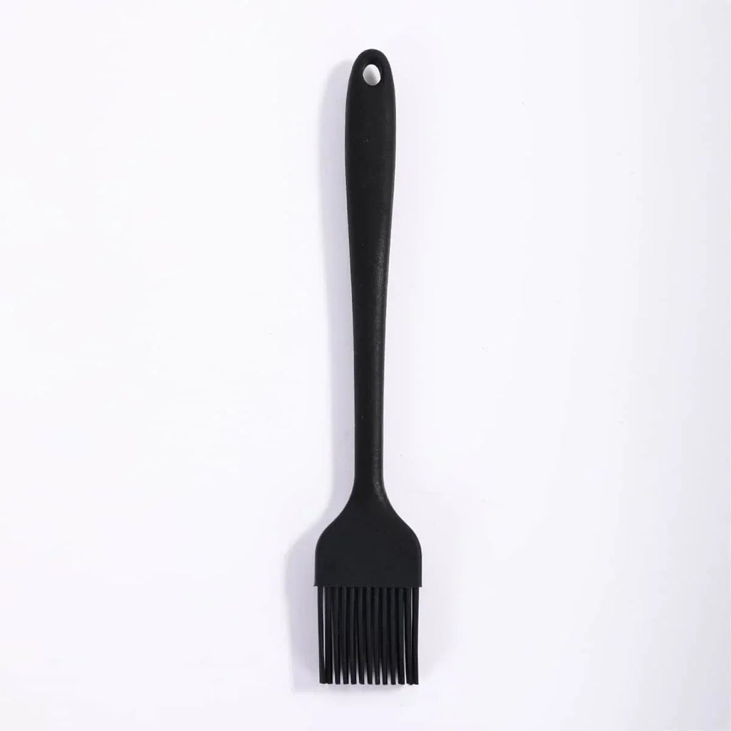 Black barbecue brush on a white background