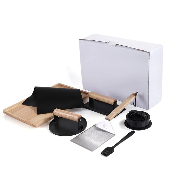 Set of barbecue tools including a spatula, brush, and other accessories on a white background.