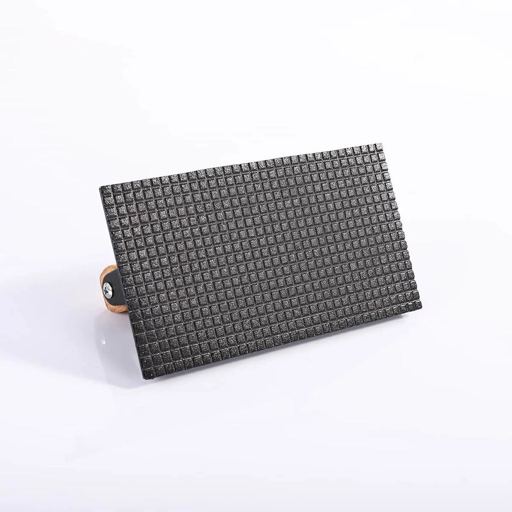 Black textured wallet with a wooden buckle on a white background