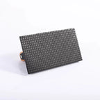 Black textured wallet with a wooden buckle on a white background