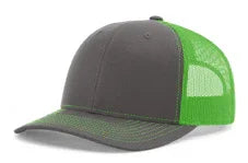 Split charcoal and neon green mesh trucker cap with curved brim and structured crown