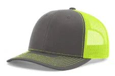 Split charcoal and neon yellow mesh trucker cap with curved brim and stitch detailing