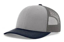 Trucker hat with grey front panel, charcoal mesh back, and navy blue curved brim