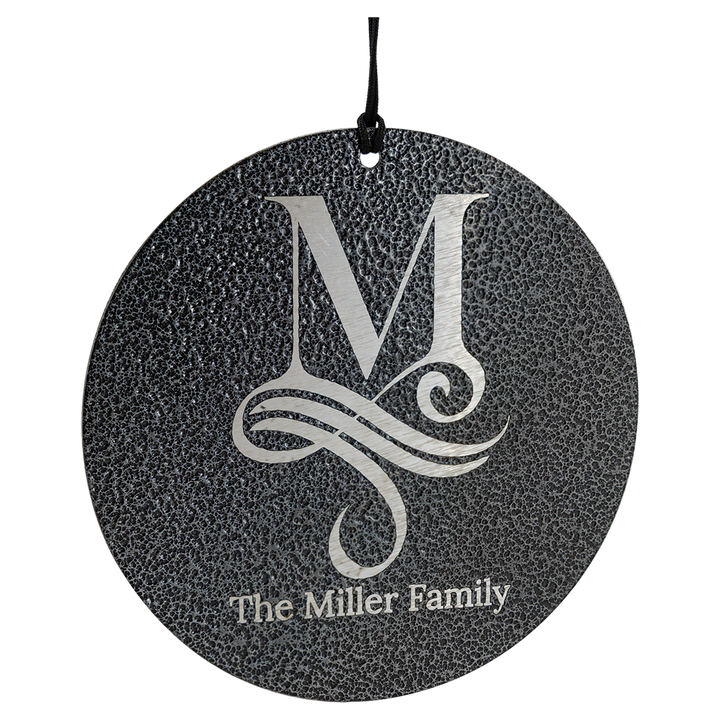 Decorative round ornament with a monogram 'M' and text 'The Miller Family' on a speckled gray background.