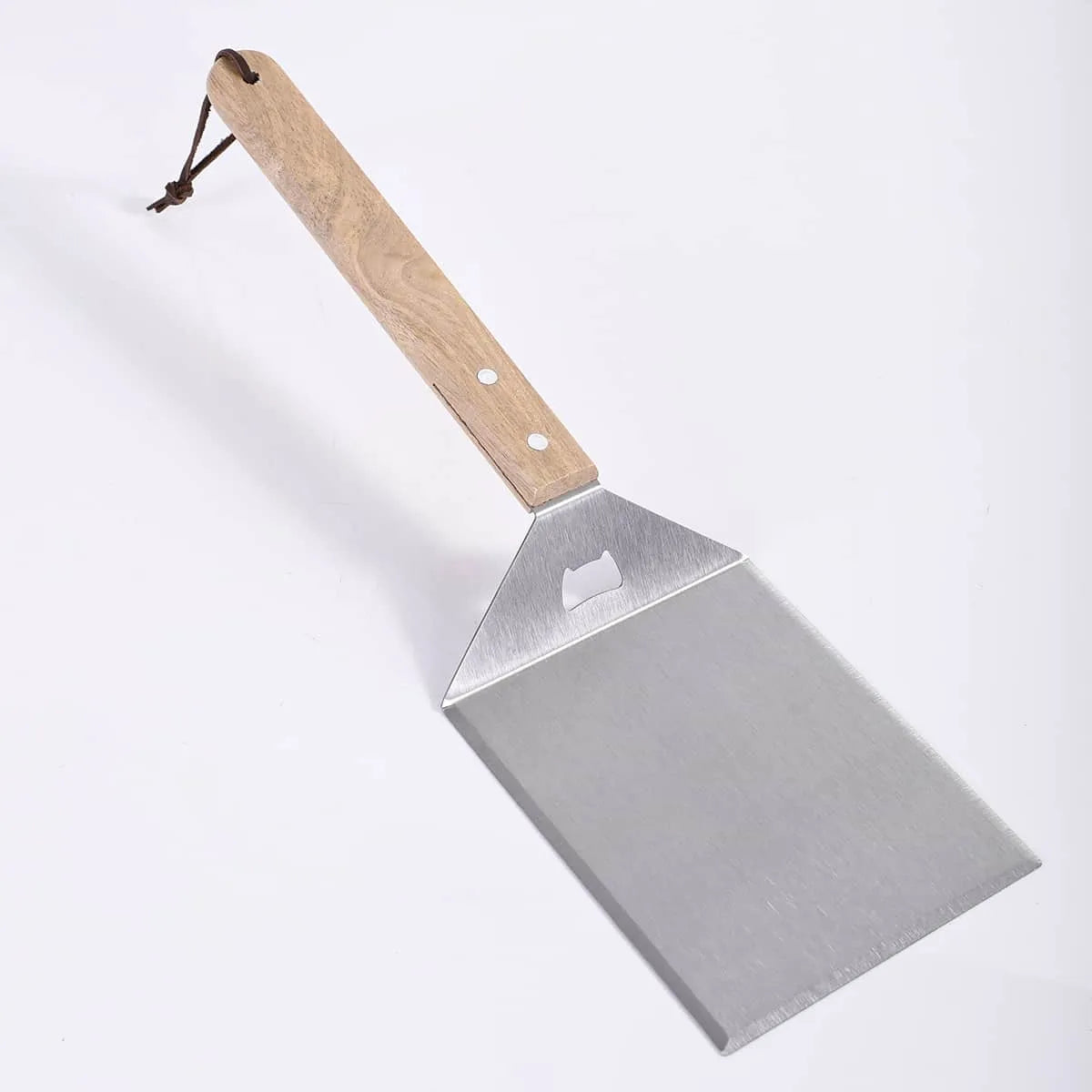Metal spatula with wooden handle on a white background